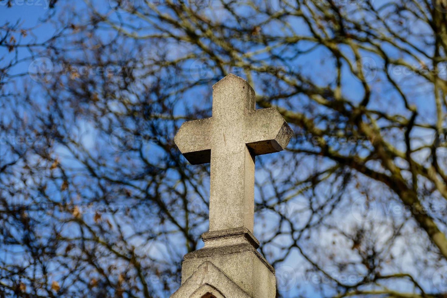 Cross in cemetery photo