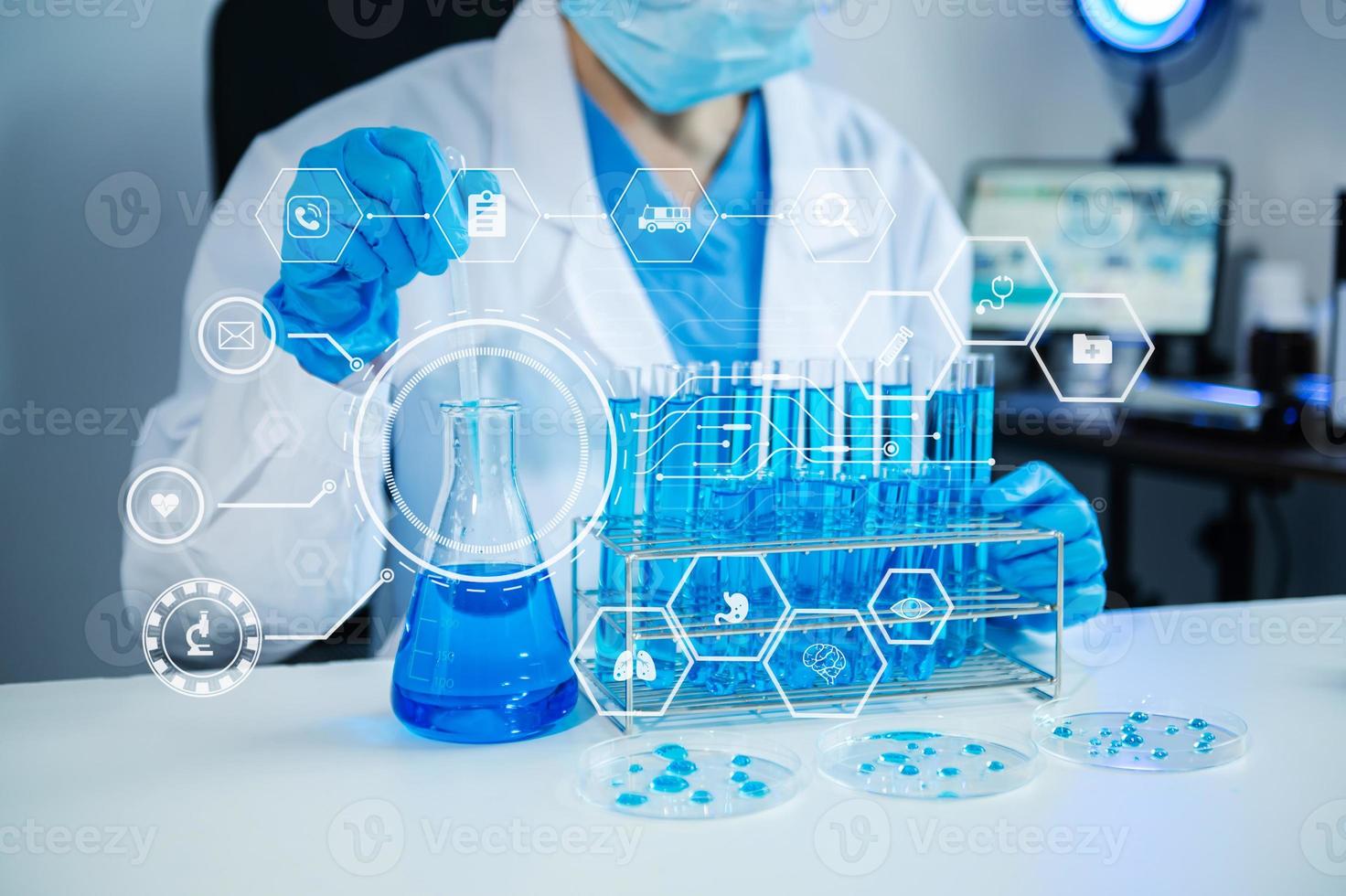 Female scientist researcher conducting an experiment working in the chemical laboratory photo