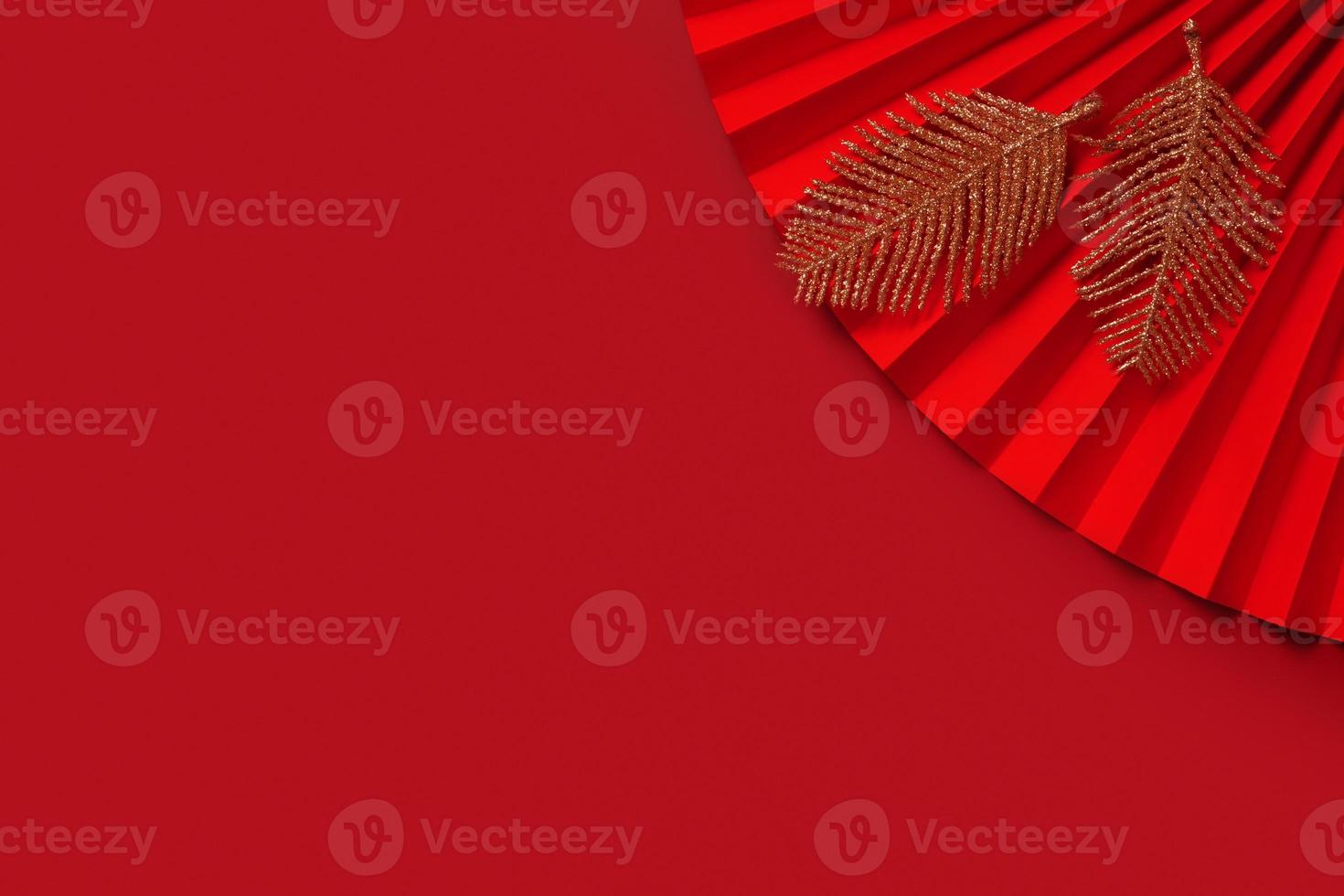Paper fan symbol Chinese new year top view with copy space on red background photo