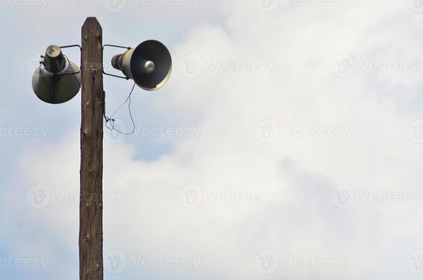 Railway speaker on a wooden pole photo