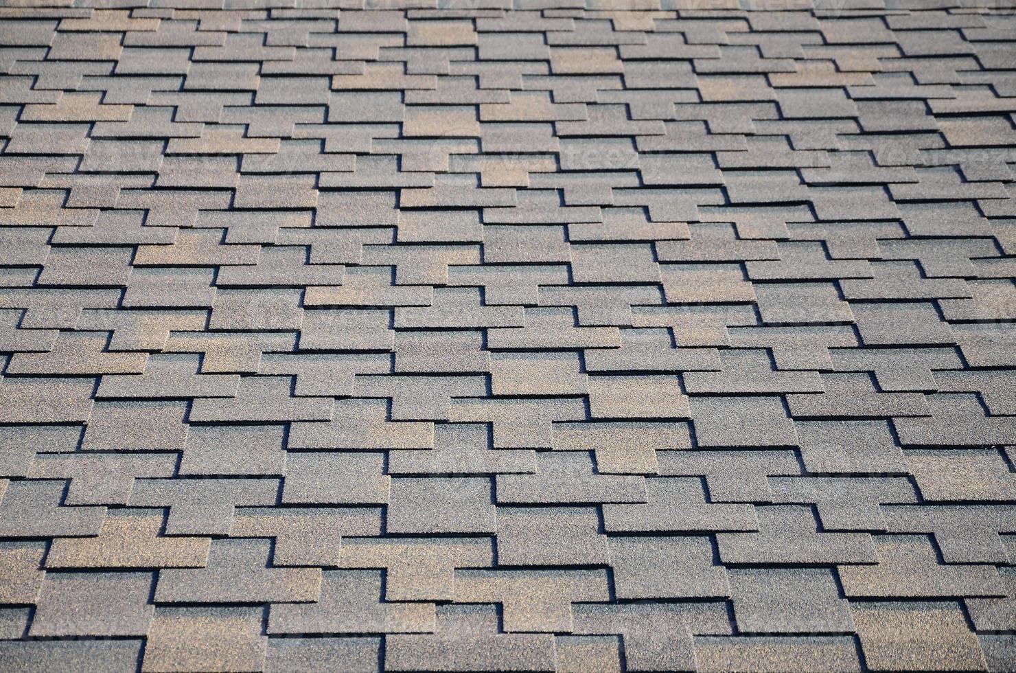 Modern roofing and decoration of chimneys. Flexible bitumen or slate shingles photo