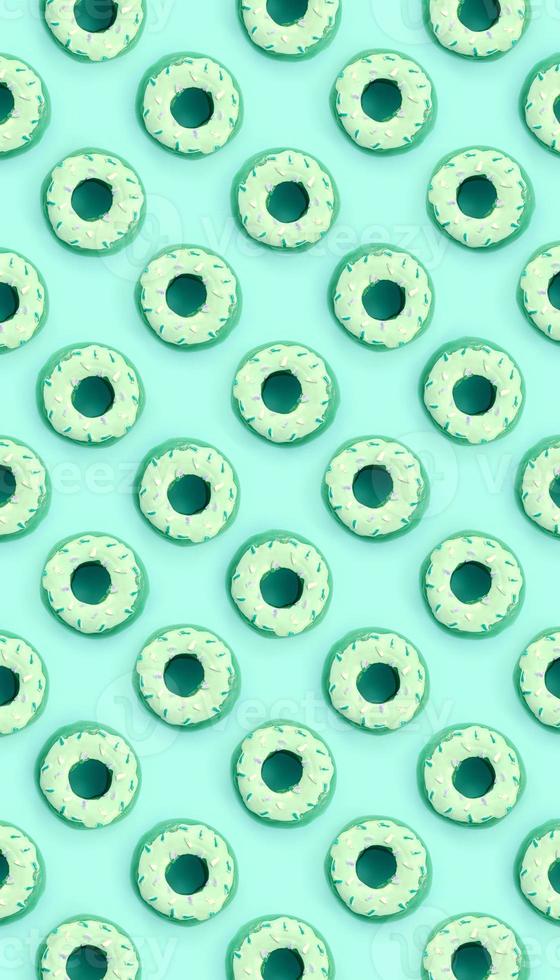 Many small plastic donuts lies on a pastel colorful background. Flat lay minimal pattern. Top view photo
