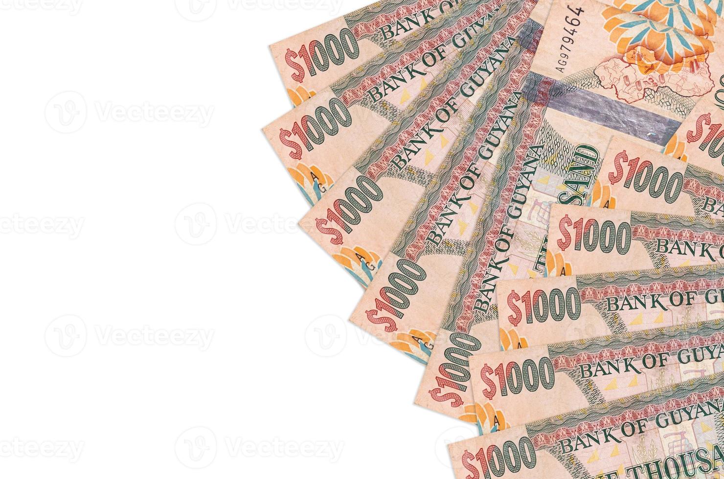 1000 Guyanese dollars bills lies isolated on white background with copy space. Rich life conceptual background photo