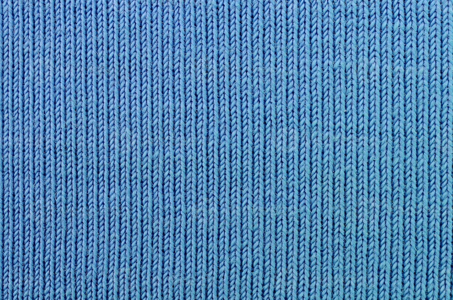 la textura de la tela en color azul. material para hacer camisas y blusas foto