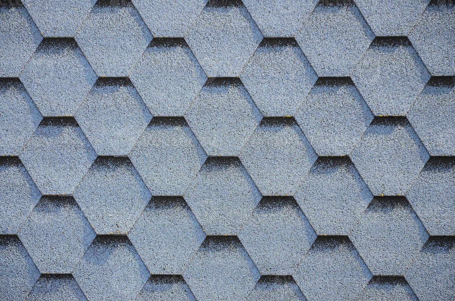 Modern roofing and decoration of chimneys. Flexible bitumen or slate shingles photo