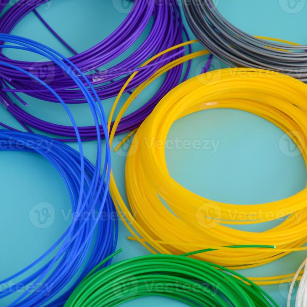 Plastic PLA and ABS filament material for printing on a 3D pen or printer of various colors photo