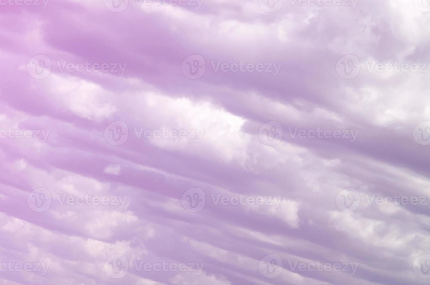 A blue sky with lots of white clouds of different sizes photo