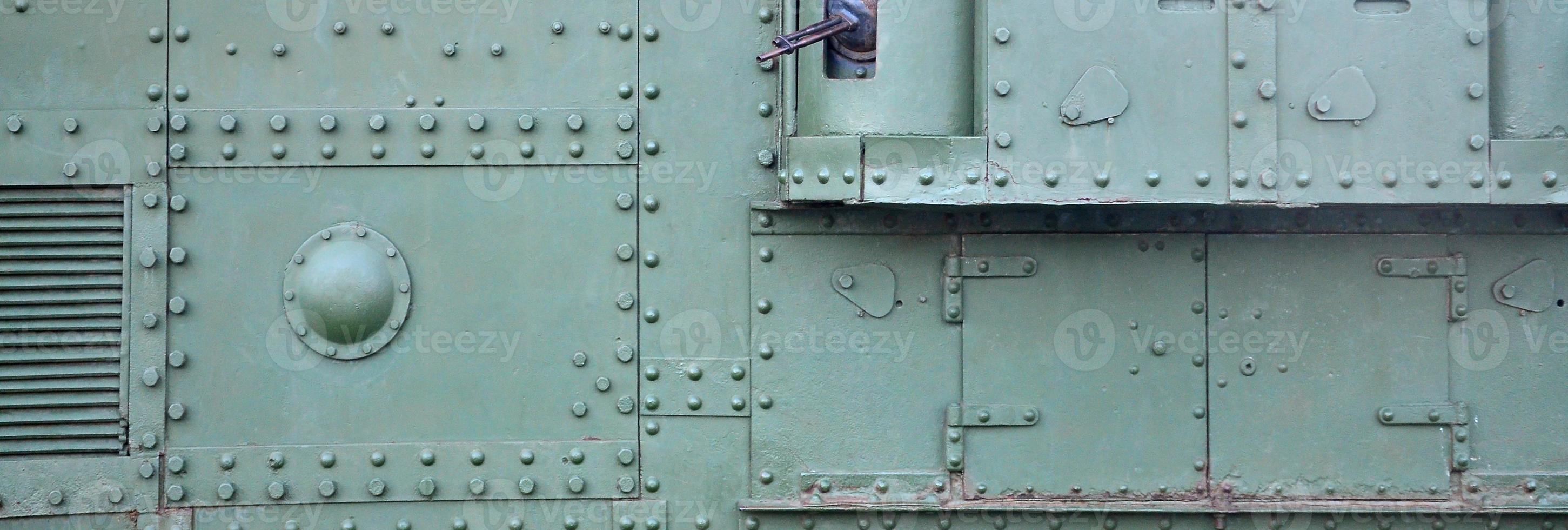 Abstract green industrial metal textured background with rivets and bolts photo