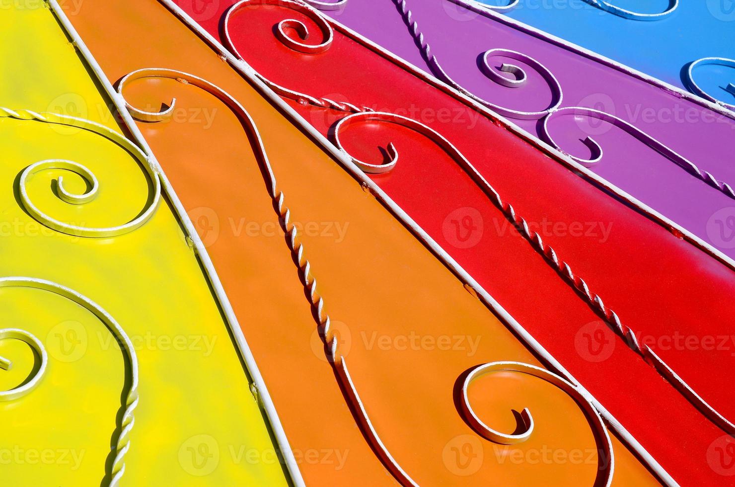 Metal texture of a piece of colored wall with a forged pattern photo