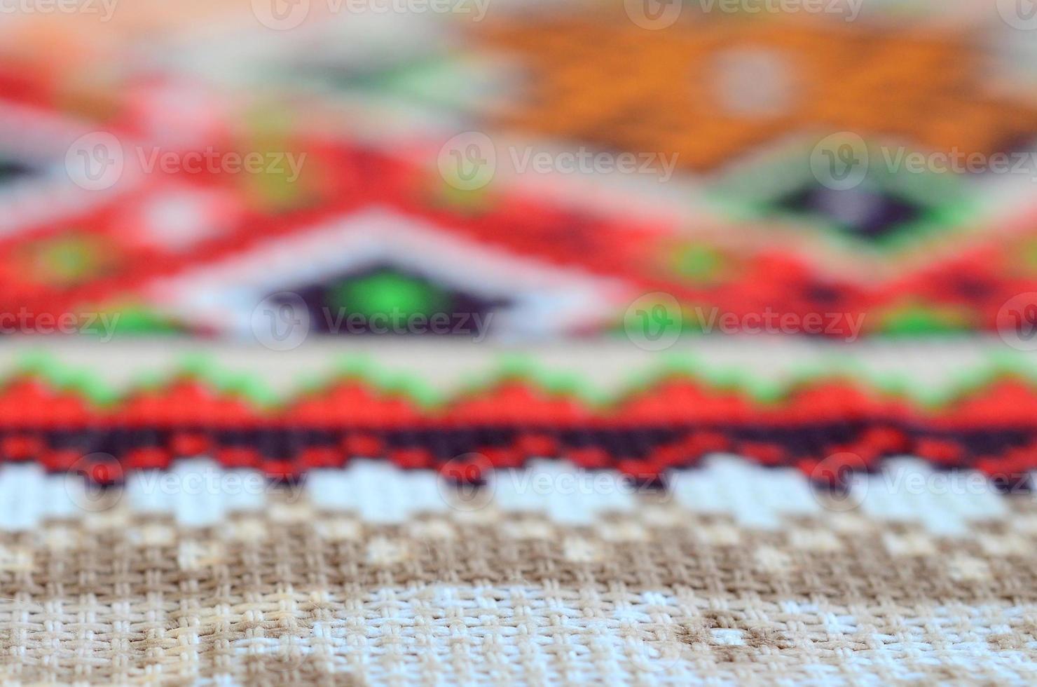 Traditional Ukrainian folk art knitted embroidery pattern on textile fabric photo