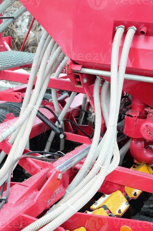 Springs and tubes are arranged in a row. A row of seeder. Heavy equipment on agricultural exhibition photo