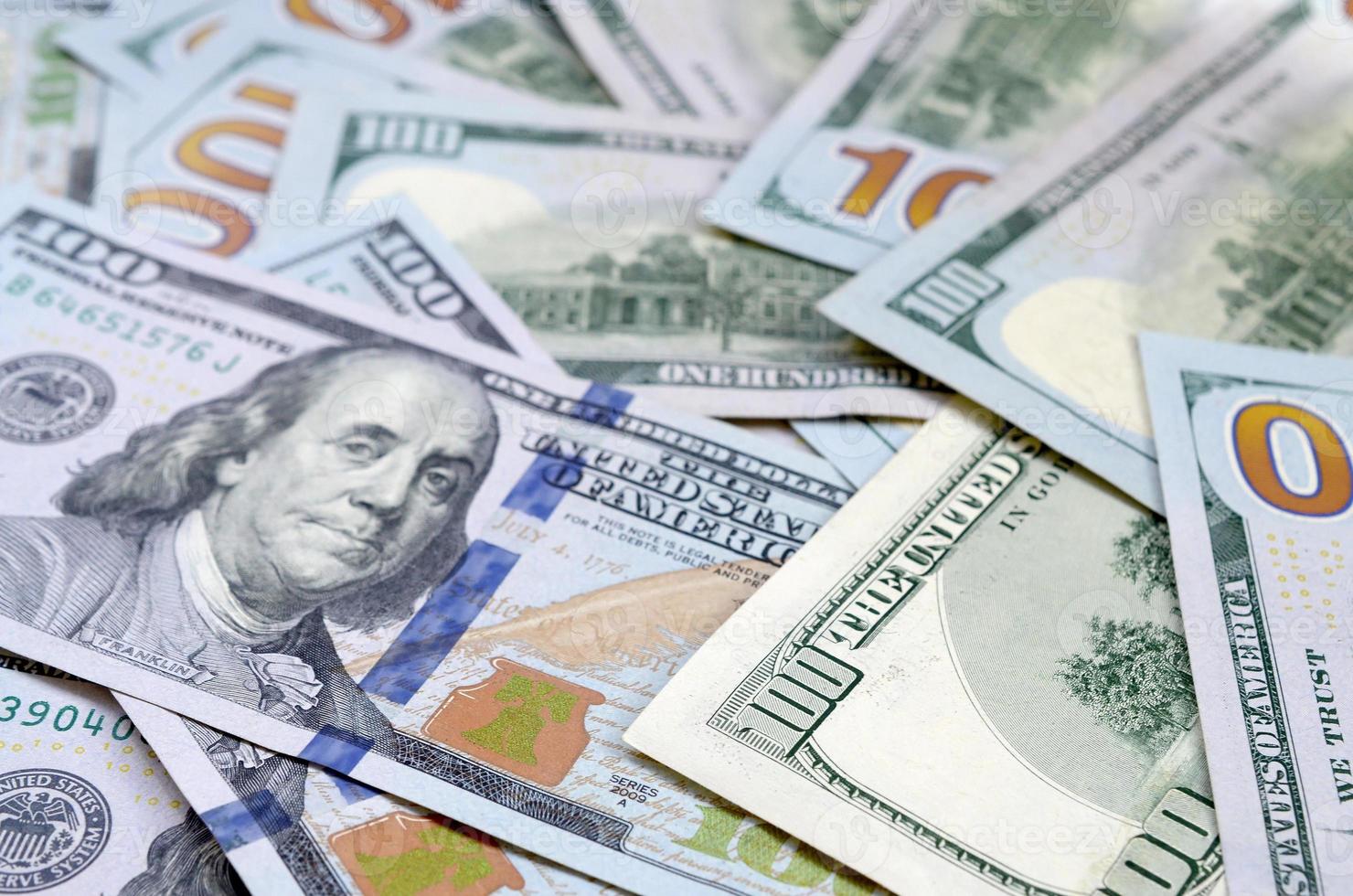 Top view of one hundred dollar banknotes made background. USD currency concept and rich life photo