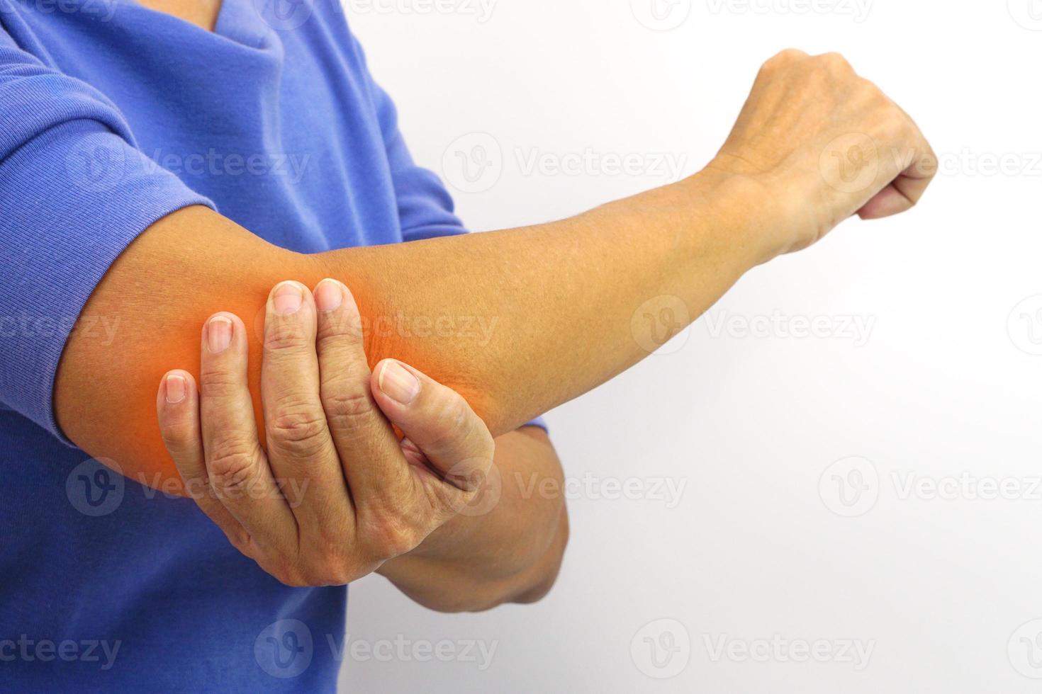 Woman suffering from elbow pain on white background. Healthcare and office syndrome concept. photo