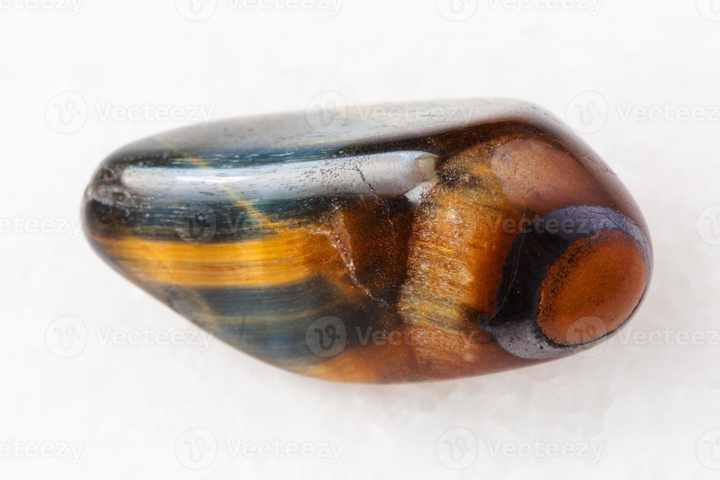 tiger's eye and hawk's eye gemstone on white photo