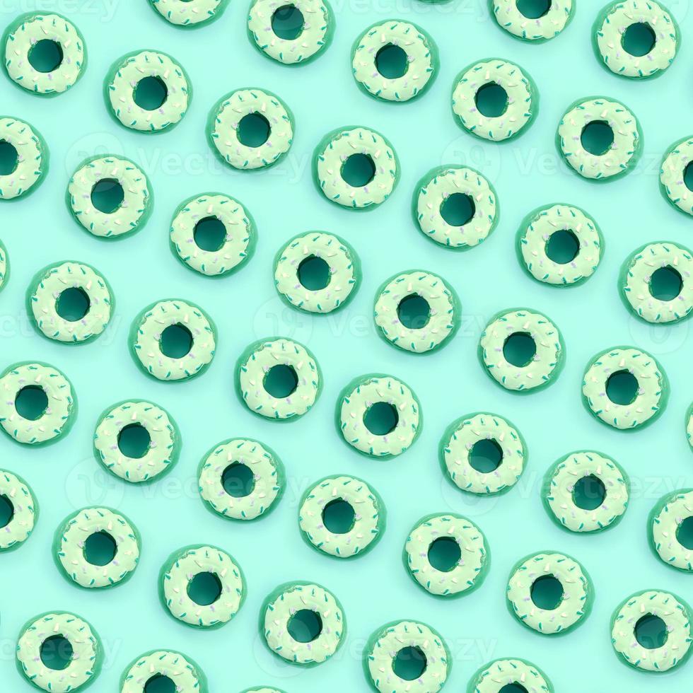 Many small plastic donuts lies on a pastel colorful background. Flat lay minimal pattern. Top view photo
