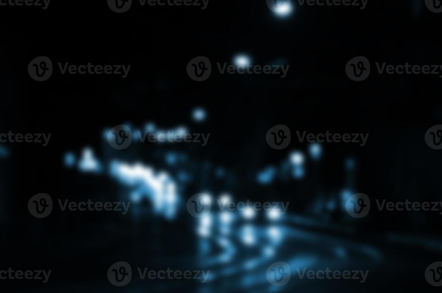 Blurred night scene of traffic on the roadway. Defocused image of cars traveling with luminous headlights. Bokeh Art photo