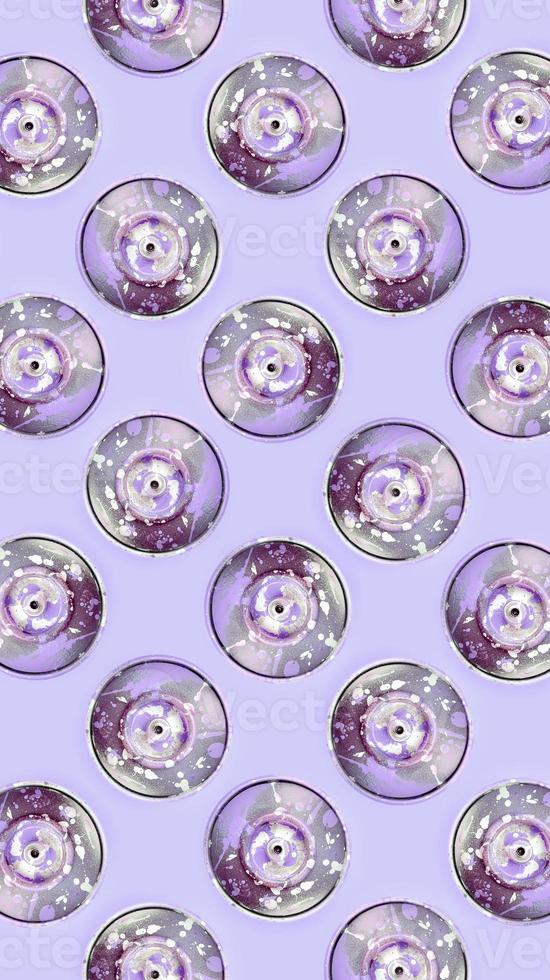 Many used spray cans for graffiti drawing lies on a pastel colored backgroung. Street art painting concept. Minimal flat lay pattern. Top view photo