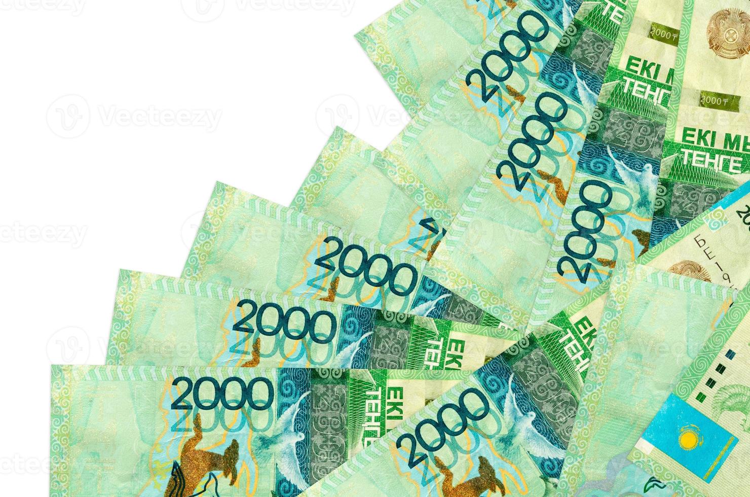 2000 Kazakhstani tenge bills lies in different order isolated on white. Local banking or money making concept photo