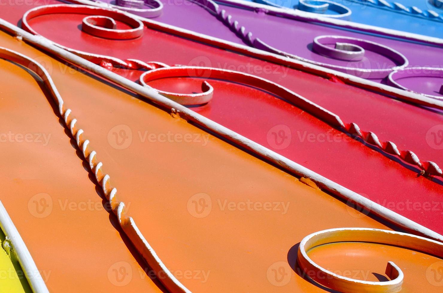 Metal texture of a piece of colored wall with a forged pattern photo