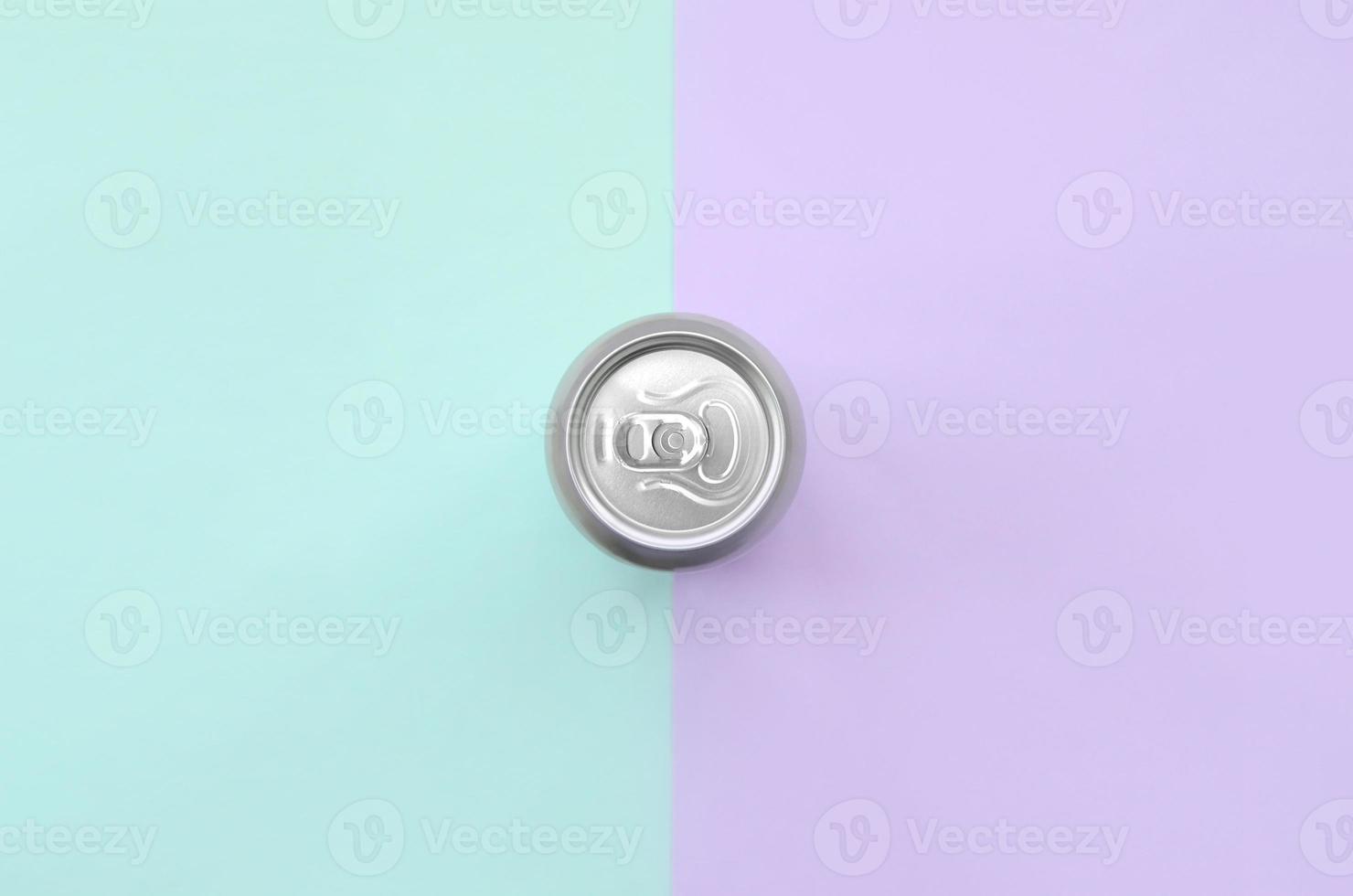 Metallic beer can on texture background of fashion pastel violet and blue colors paper in minimal concept photo