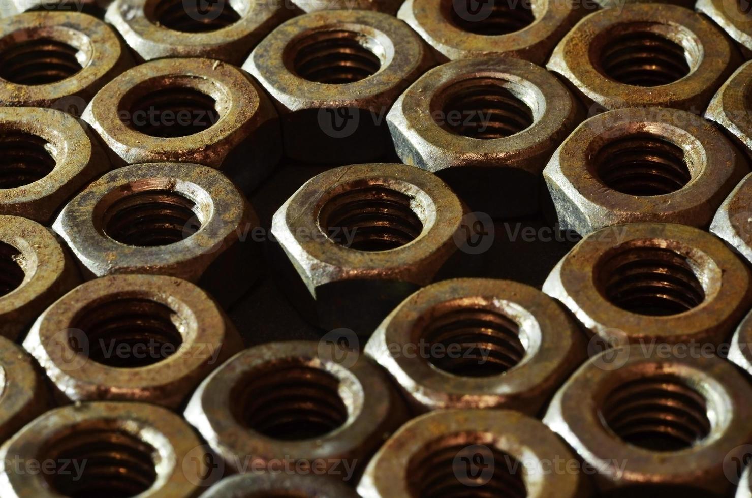 Close-up of rusty nuts photo