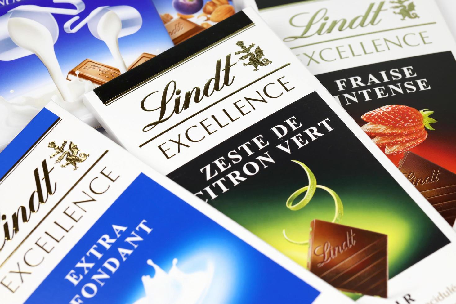 KHARKIV, UKRAINE - DECEMBER 18, 2022 Lindt Chocolate on white background. Lindt and Spruengli AG is a Swiss chocolatier and confectionery company known for their chocolate bars photo