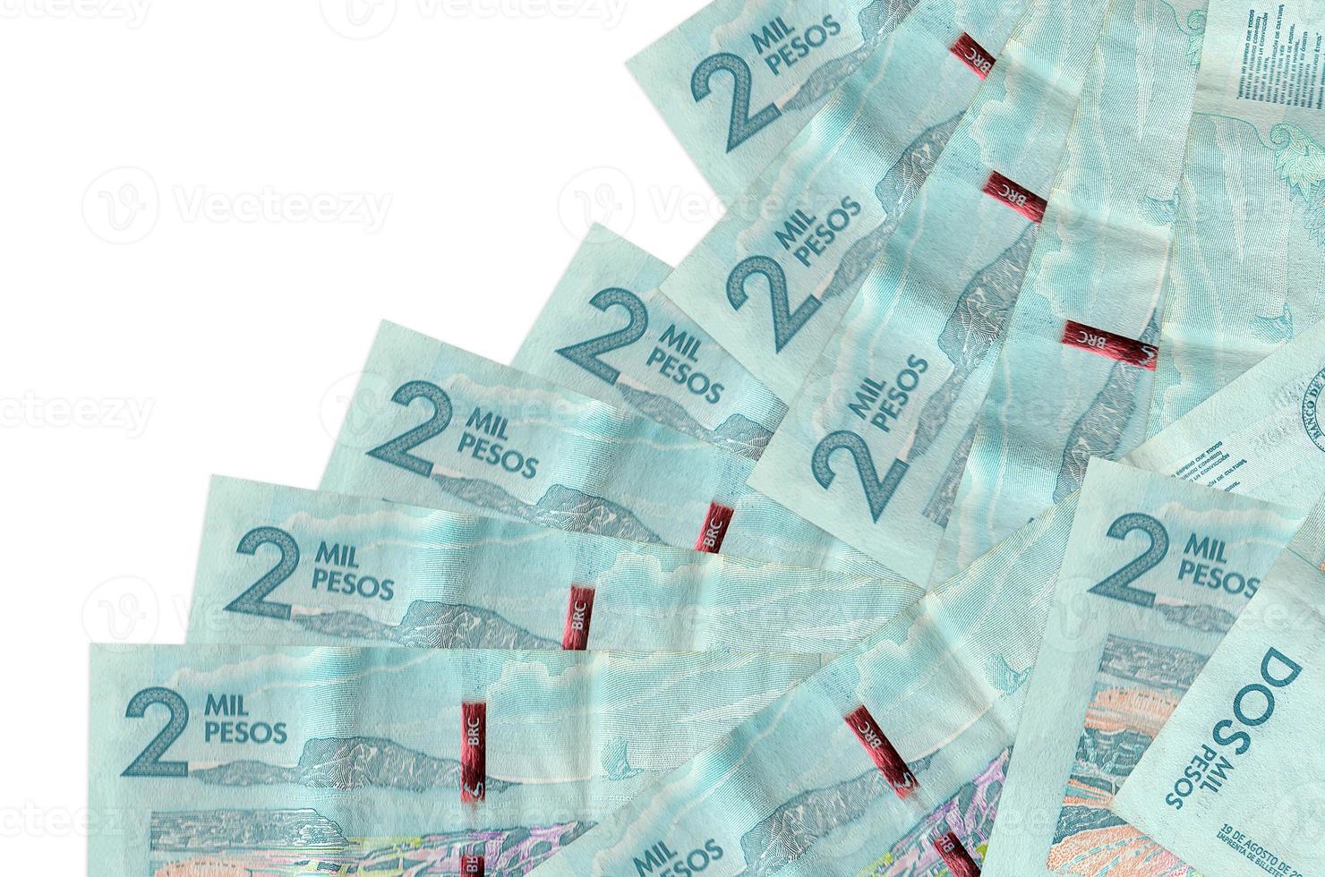 2 Colombian pesos bills lies in different order isolated on white. Local banking or money making concept photo