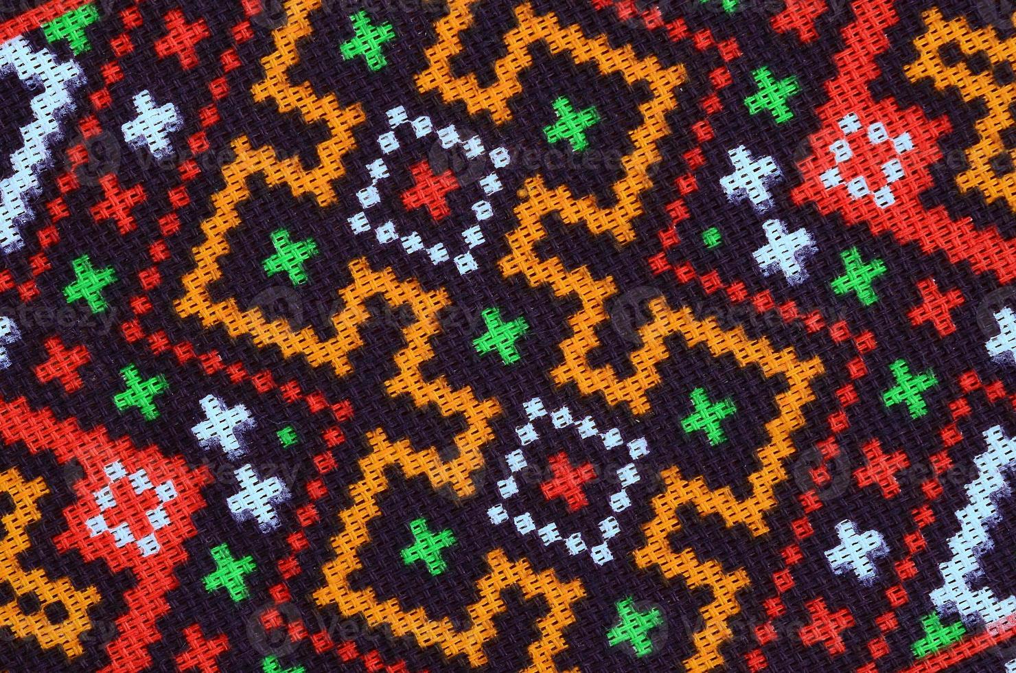 Traditional Ukrainian folk art knitted embroidery pattern on textile fabric photo
