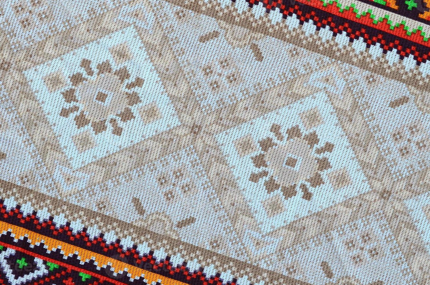 Traditional Ukrainian folk art knitted embroidery pattern on textile fabric photo