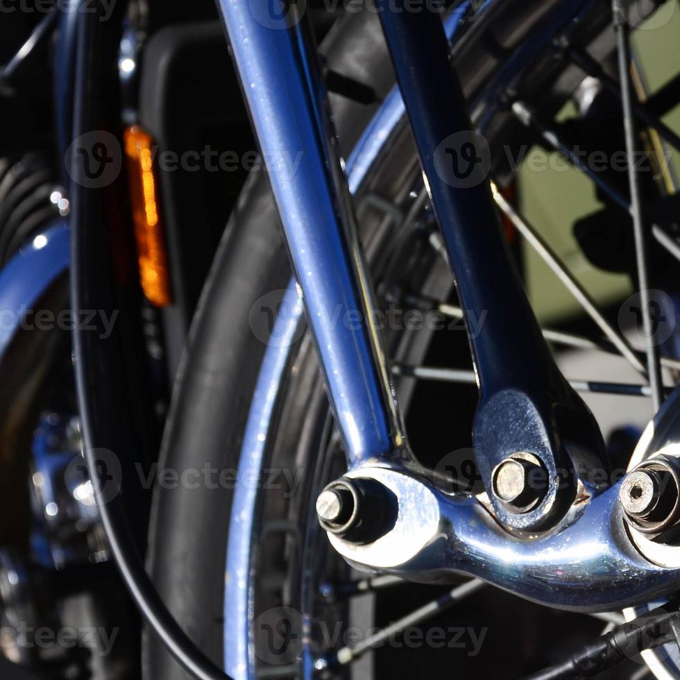 Fragment of chromed shiny wheel of old classic motorbike photo