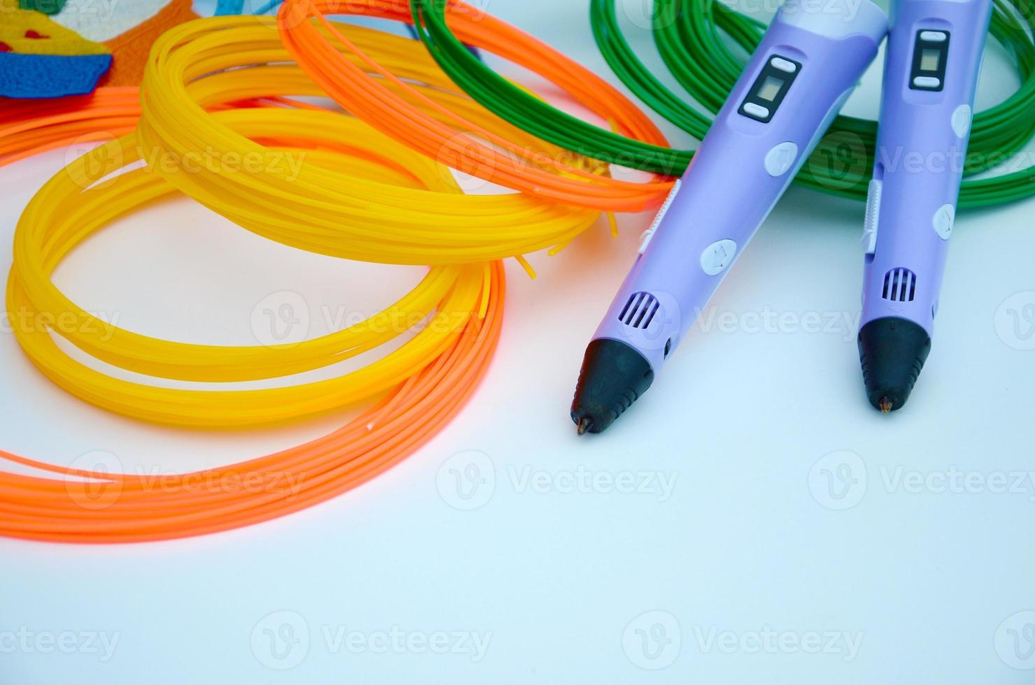 Top view on 3d pen and kit of colourful ABS plastic filament photo