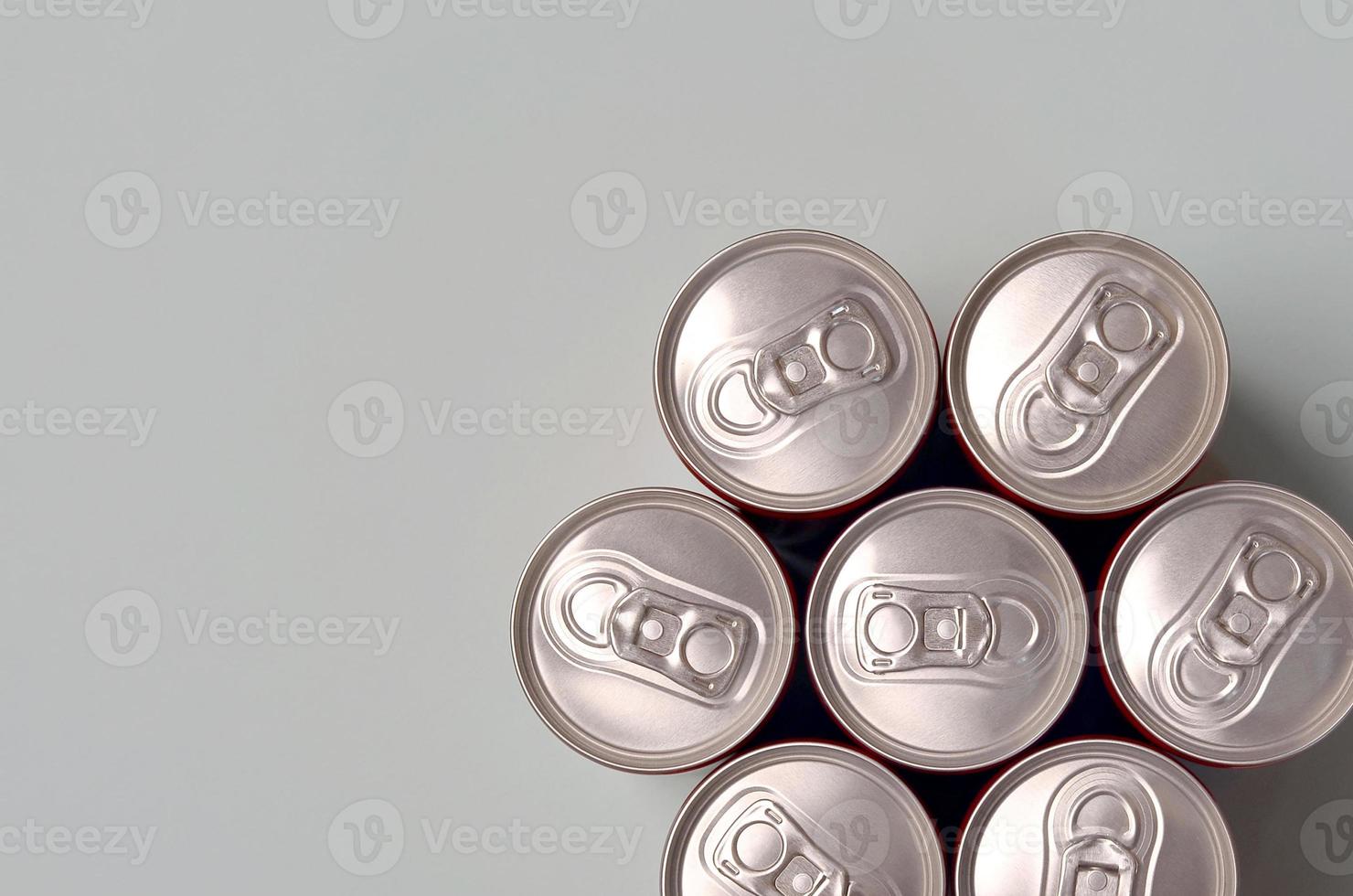Many new aluminium cans of soda soft drink or energy drink containers. Drinks manufacturing concept and mass production photo