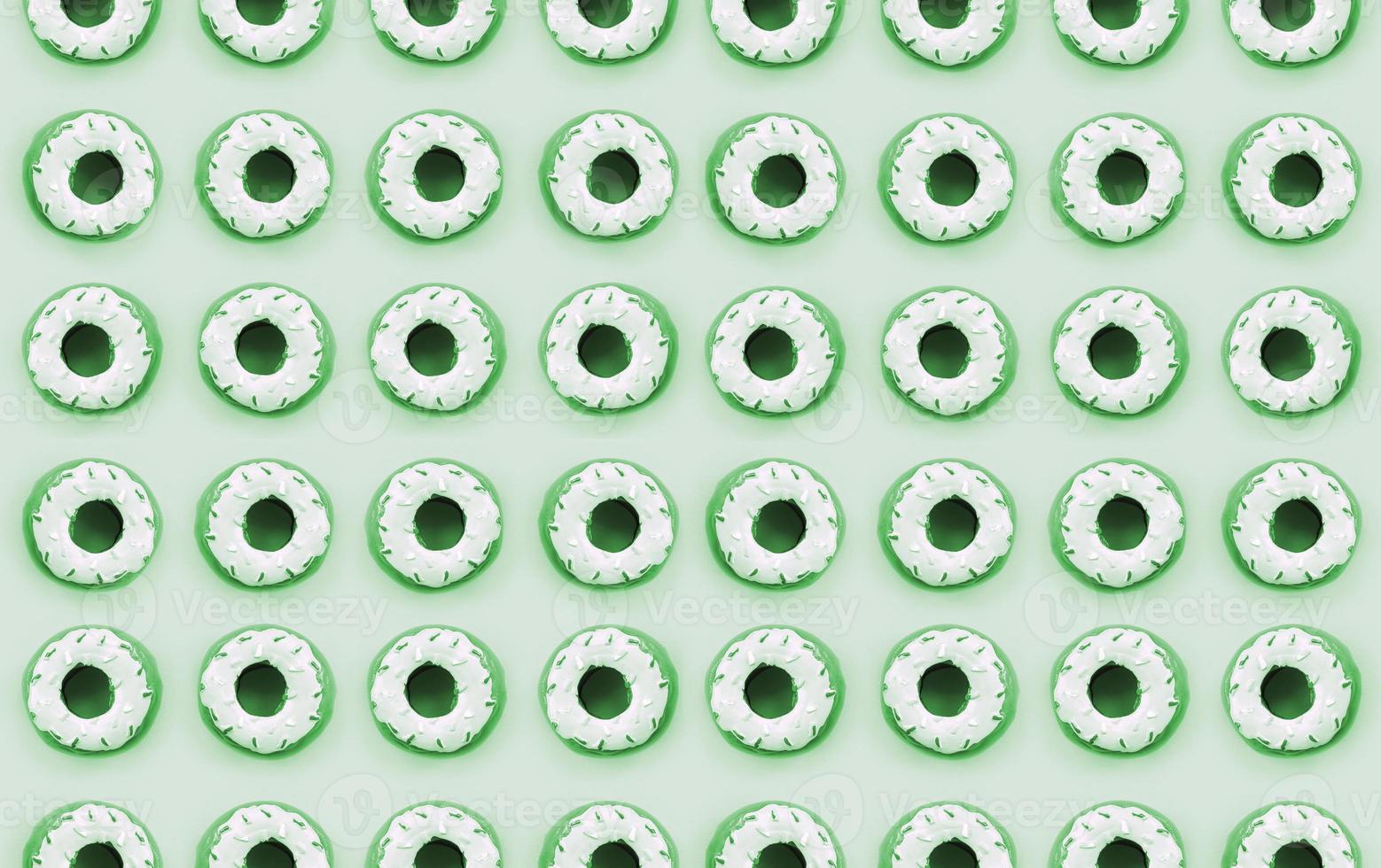 Many small plastic donuts lies on a pastel colorful background. Flat lay minimal pattern. Top view photo