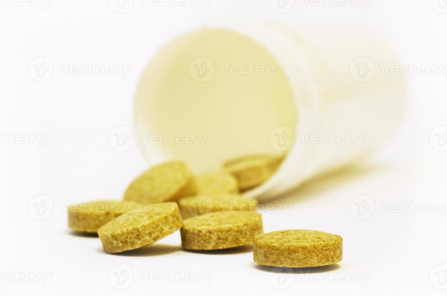 Yellow round pills photo
