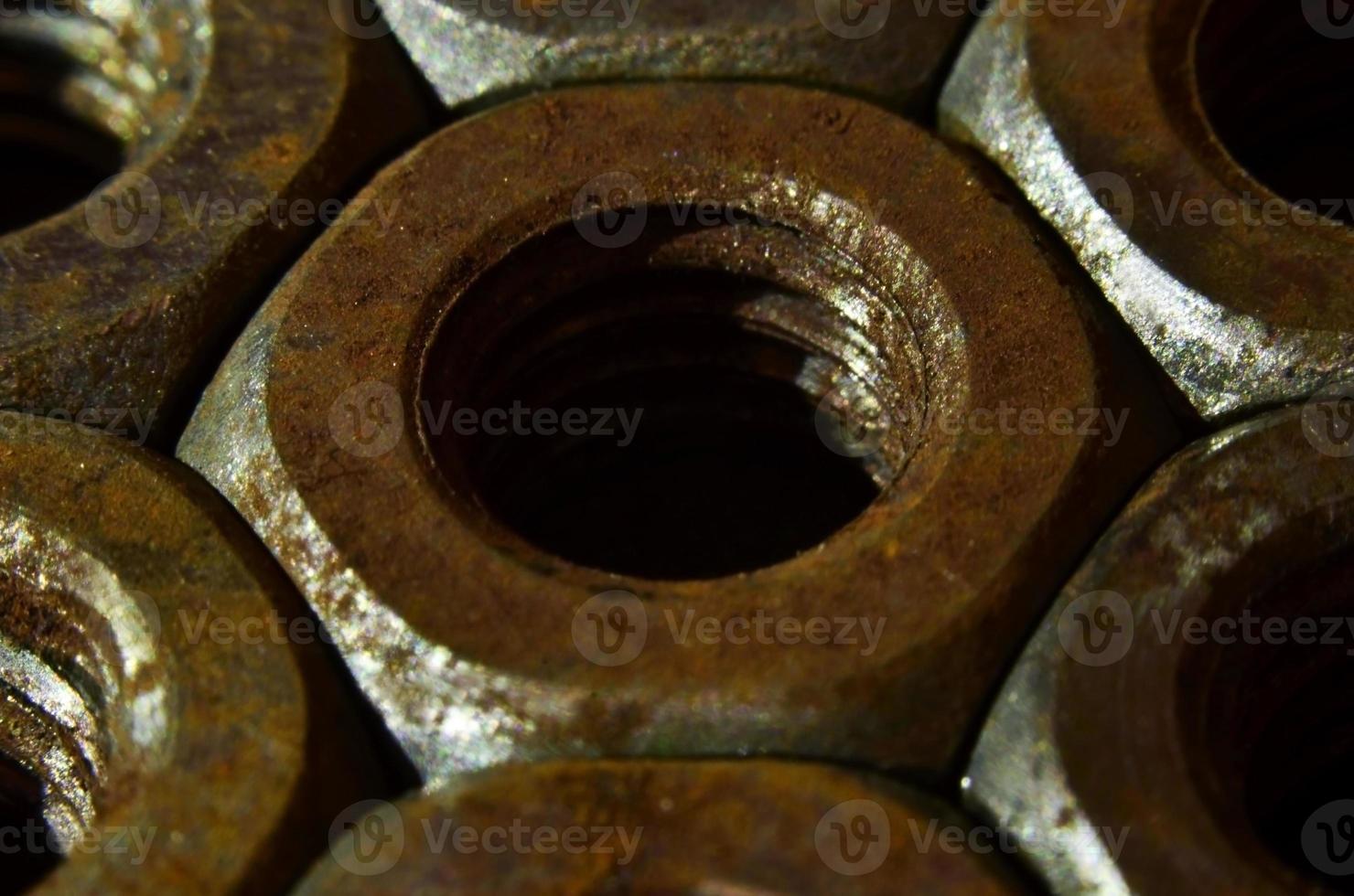 Close-up of rusty nuts photo