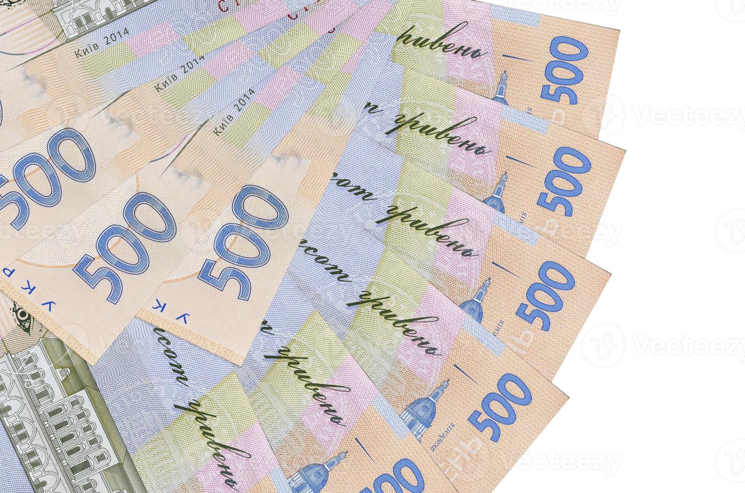 500 Ukrainian hryvnias bills lies isolated on white background with copy space stacked in fan shape close up photo