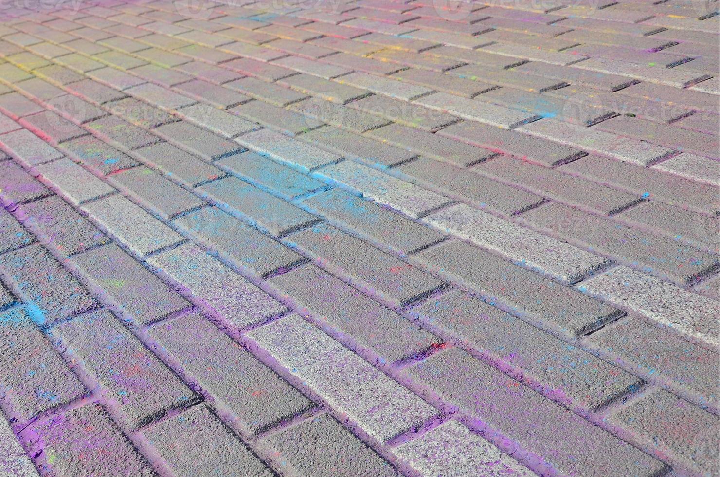 Multi colored paving slabs, powder coated with dry colors at the Holi