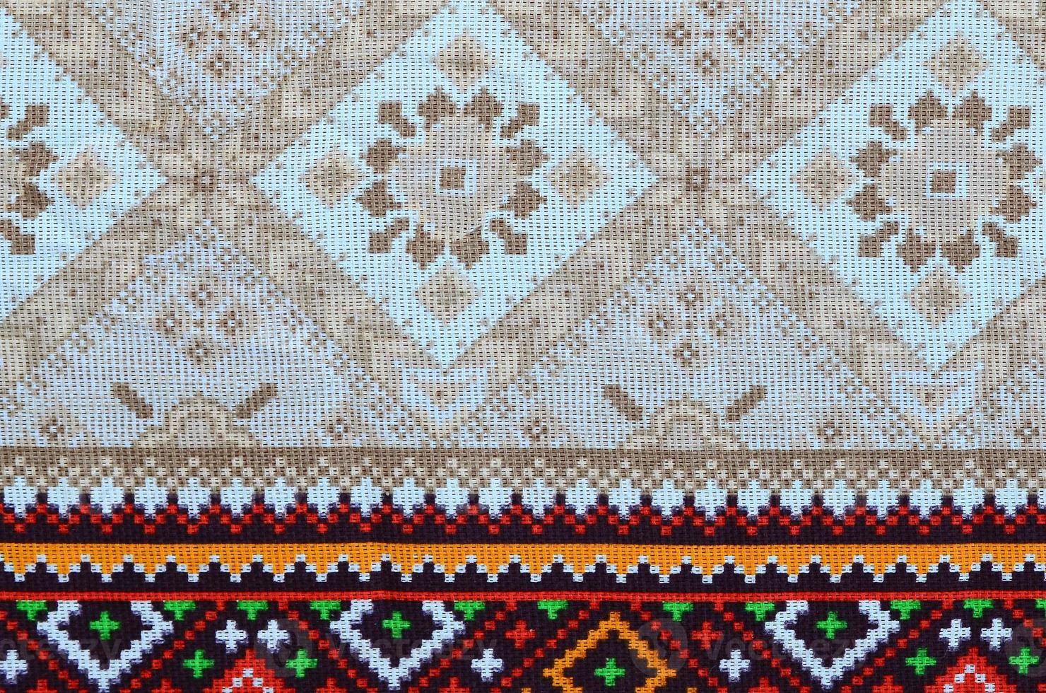 Traditional Ukrainian folk art knitted embroidery pattern on textile fabric photo