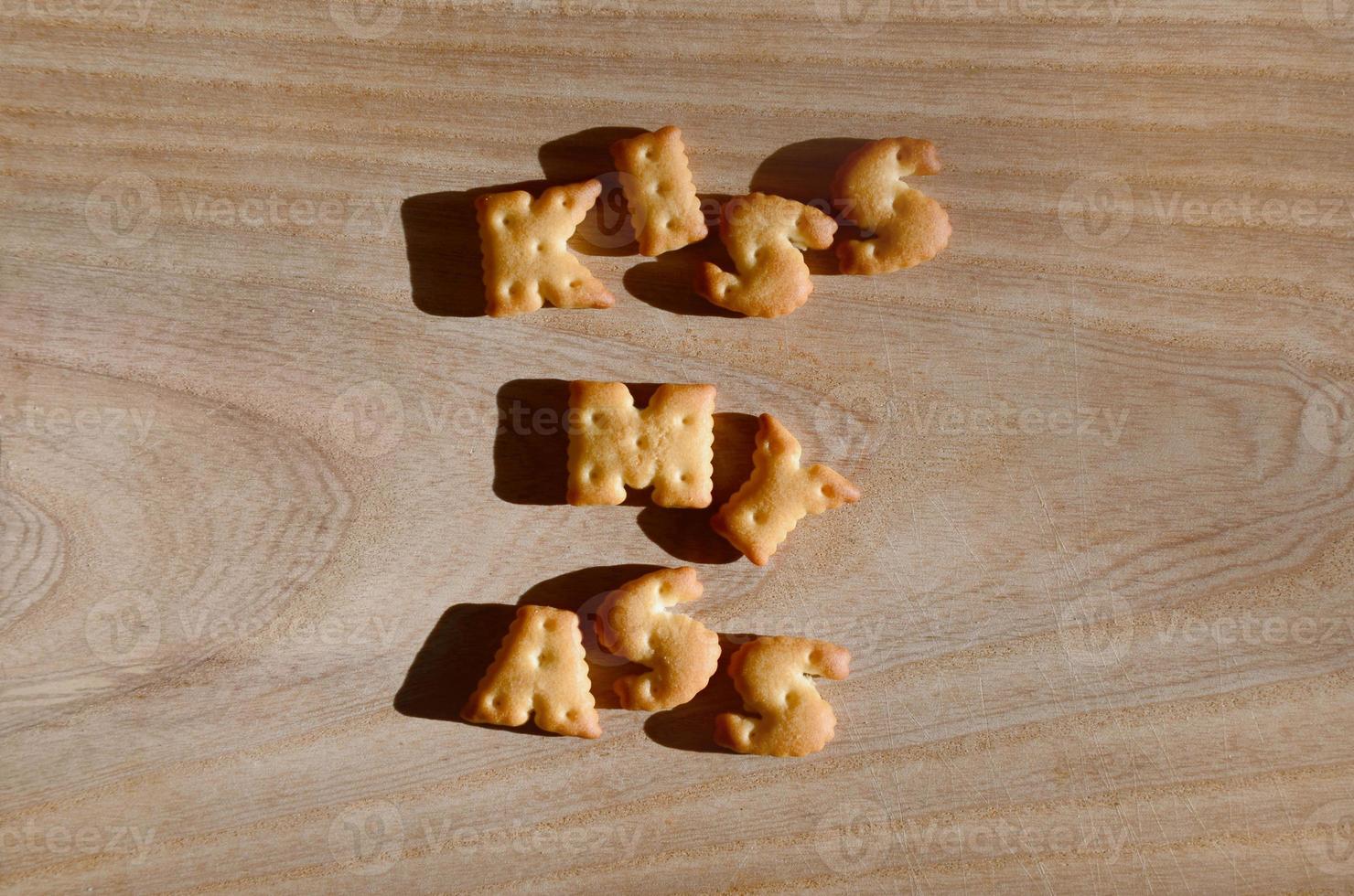 Kiss my ass. Heap of edible letters photo