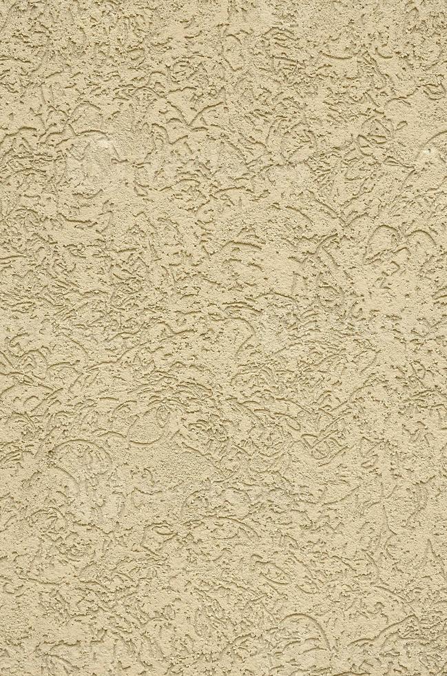 The texture of the beige decorative plaster in bark beetle style photo