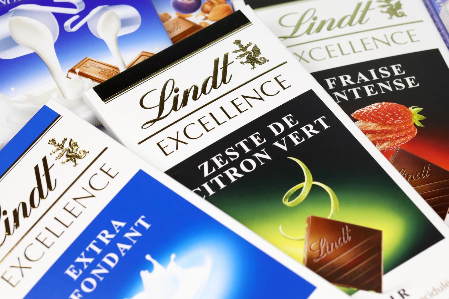 KHARKIV, UKRAINE - DECEMBER 18, 2022 Lindt Chocolate on white background. Lindt and Spruengli AG is a Swiss chocolatier and confectionery company known for their chocolate bars photo