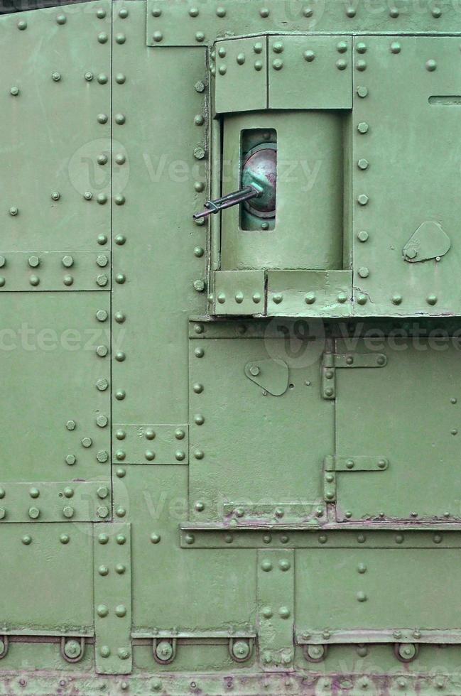 Abstract green industrial metal textured background with rivets and bolts photo