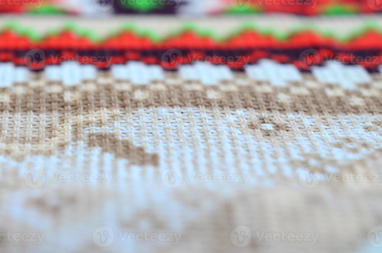 Traditional Ukrainian folk art knitted embroidery pattern on textile fabric photo