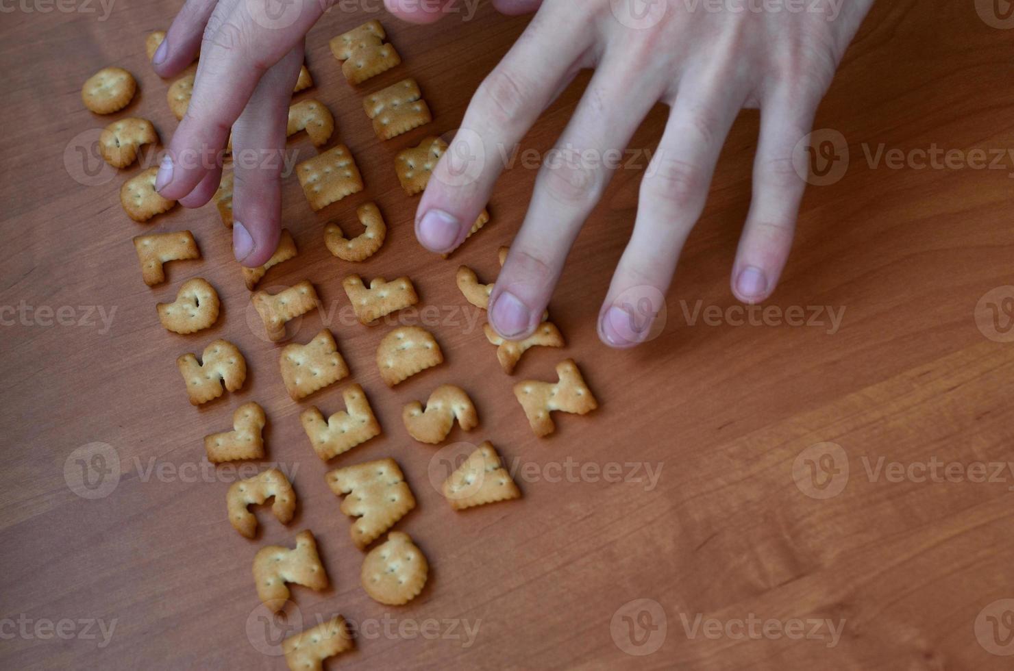 Hands on cracker keyboard buttons photo