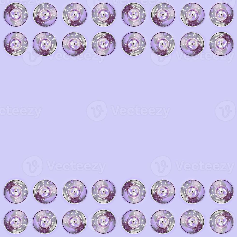 Many used spray cans for graffiti drawing lies on a pastel colored backgroung. Street art painting concept. Minimal flat lay pattern. Top view photo