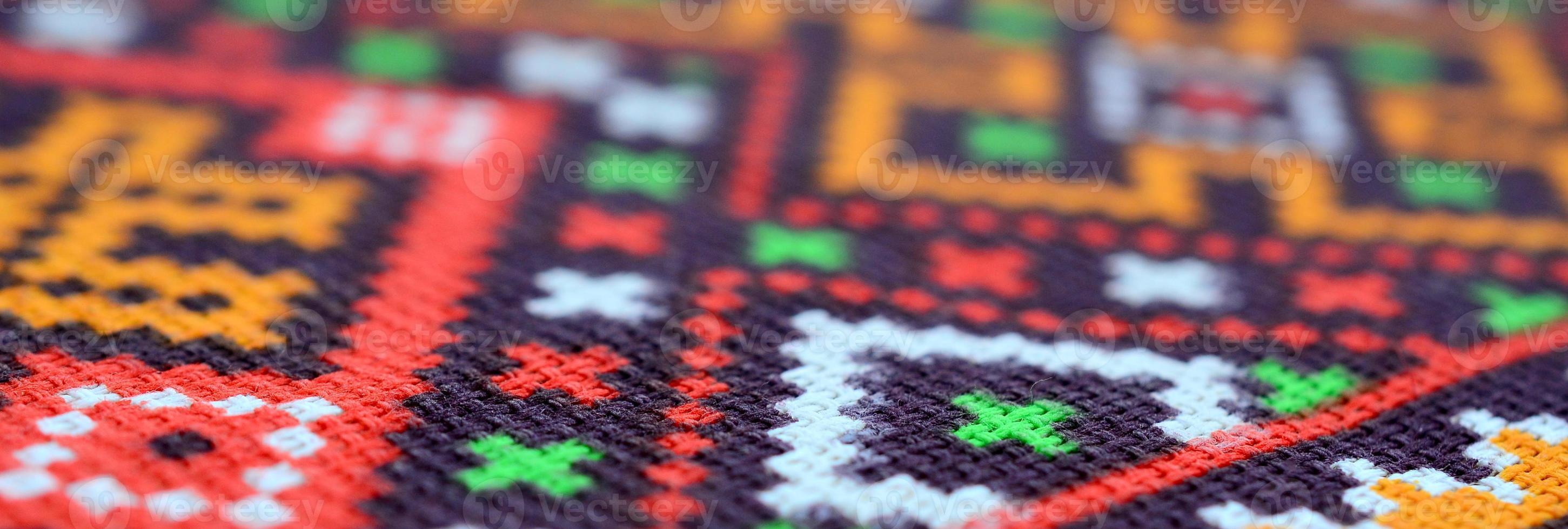 Traditional Ukrainian folk art knitted embroidery pattern on textile fabric photo