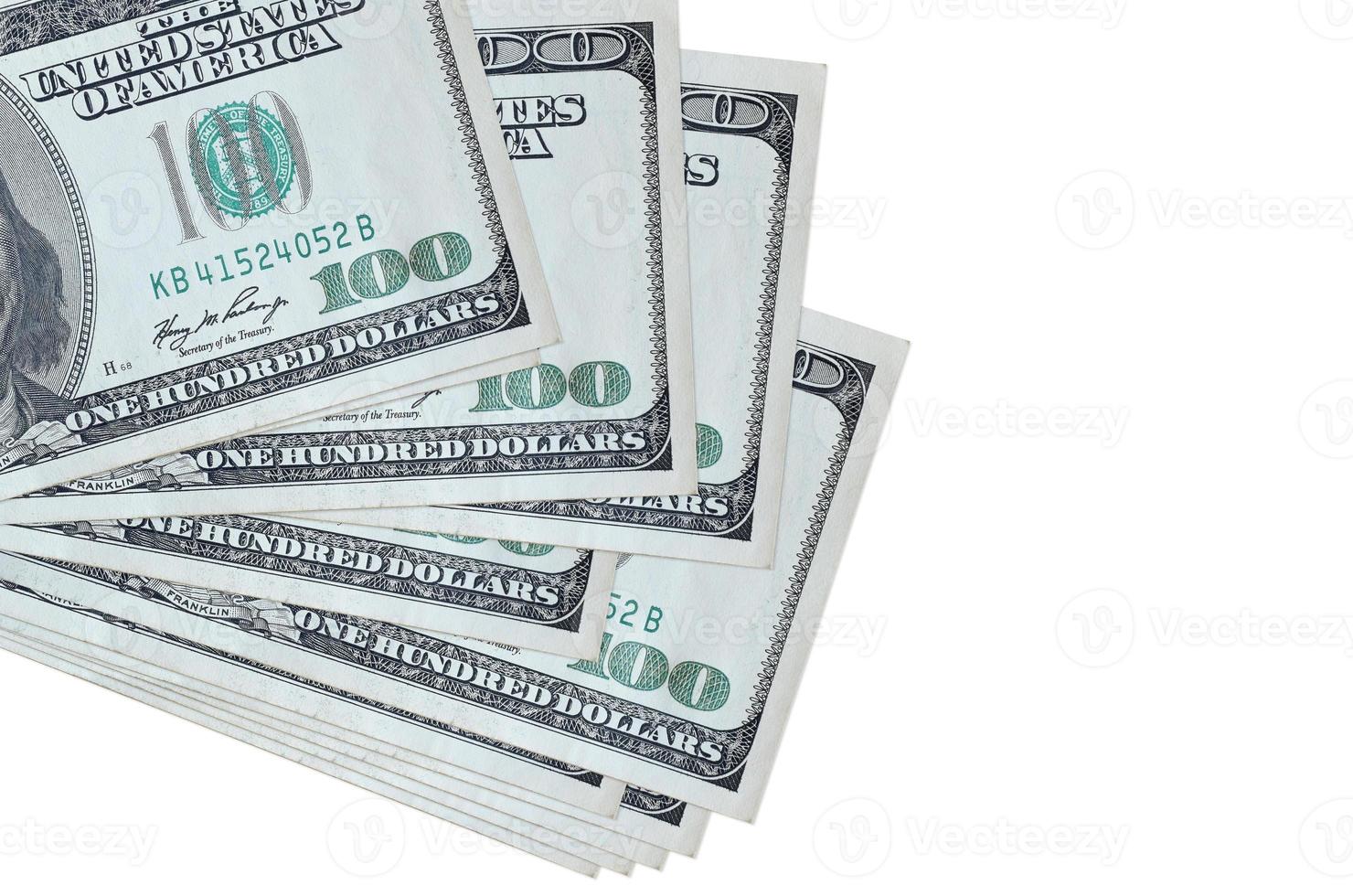 100 US dollars bills lies in small bunch or pack isolated on white. Mockup with copy space. Business and currency exchange photo