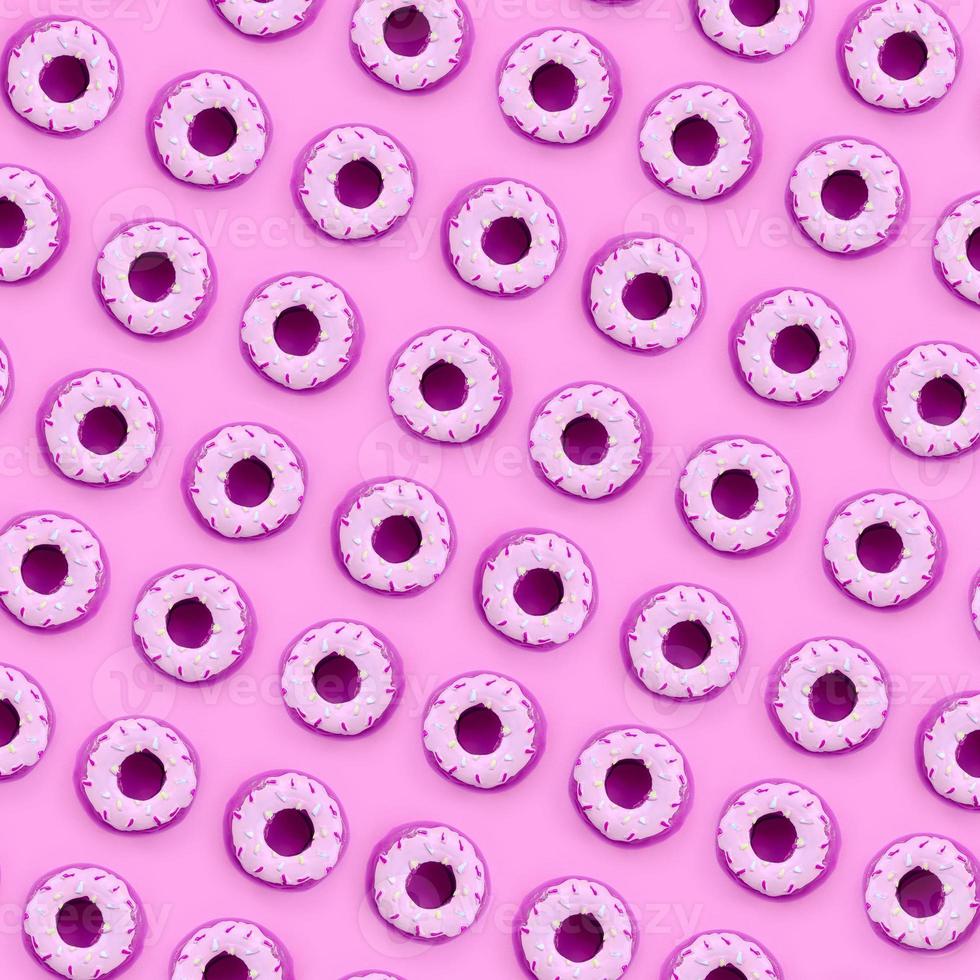 Many small plastic donuts lies on a pastel colorful background. Flat lay minimal pattern. Top view photo