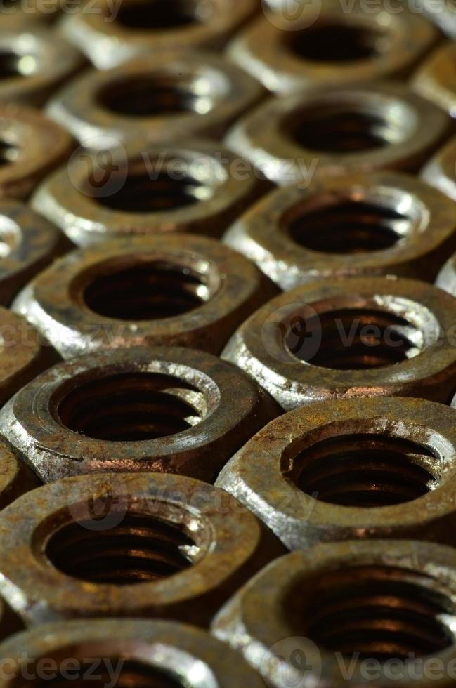 Close-up of rusty nuts photo