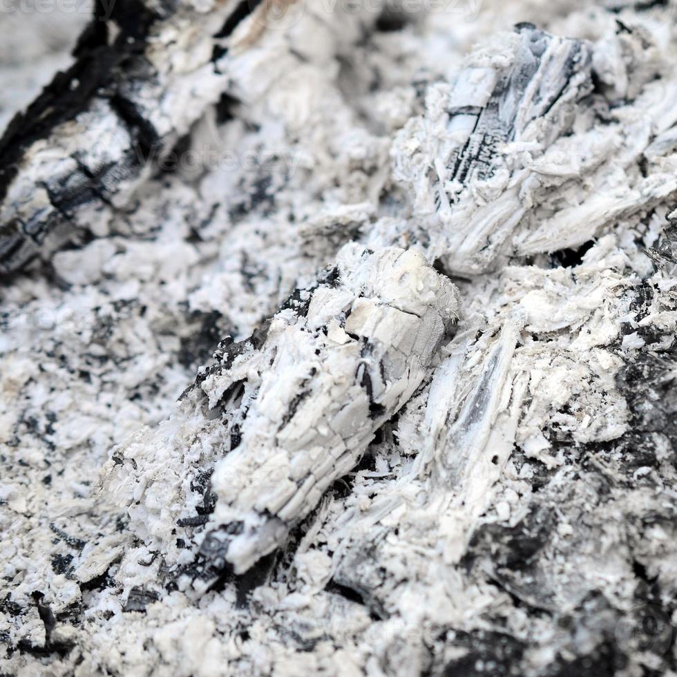 Pile of ashes after the fire went out grunge background texture photo